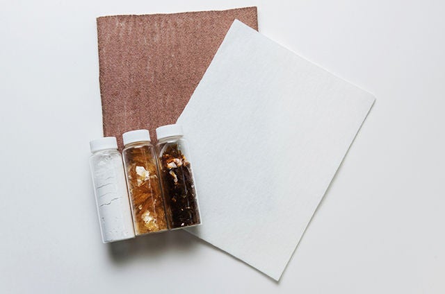 Additives are adhered to the fiber surface of the white filter to create the brown NSK oil filter that slows oil degradation.