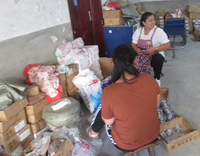 Workers assembling counterfeit bearings during a raid