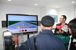 Visitors test out NSK Advanced Assist Steering.