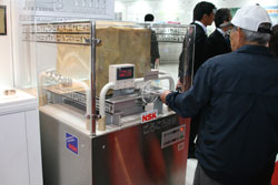 Visitors experience firsthand the sensation of bearings.