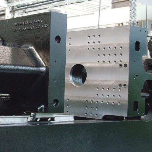 Close-up picture of injection molding machine.