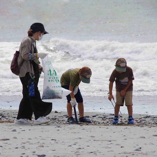 Cleaning beach, picking up trash
